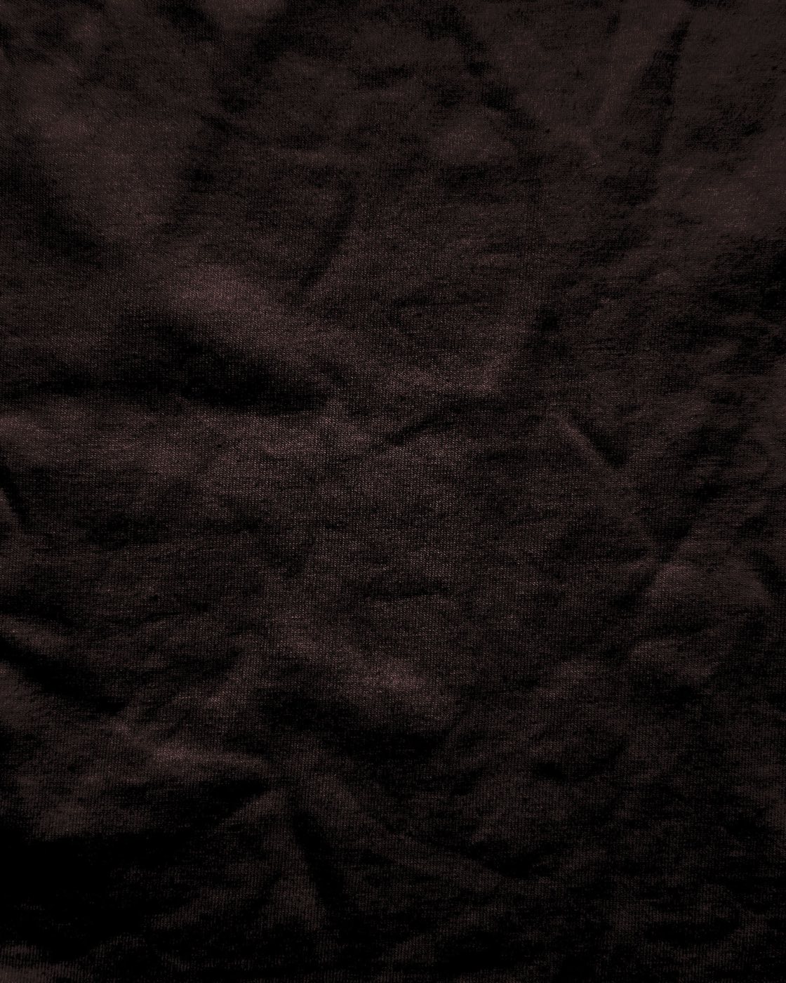 Dark cloth, creased and folded