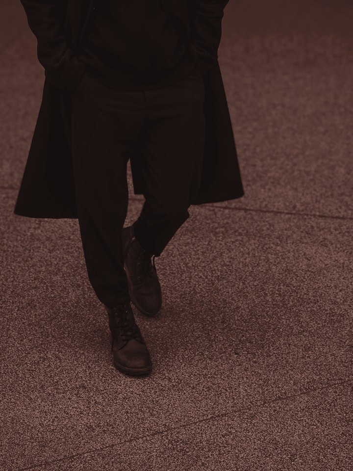 FW26 — figure in motion, hem over boot